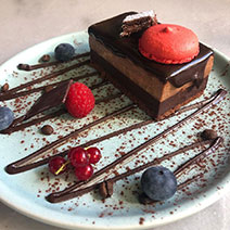 Fresh cake with chocolate and fresh forest fruits